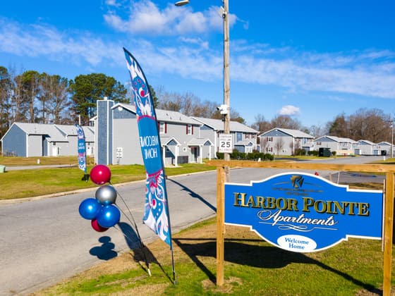 The Harbor Pointe sign at the entrance, with the buildings behind it