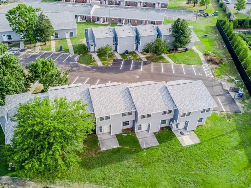 A row of pet friendly apartments seen from the lawn